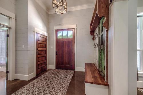 a hallway with a door and a rug at RR 7134 River Repose in Canyon Lake