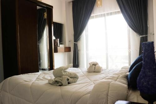 Ένα ή περισσότερα κρεβάτια σε δωμάτιο στο Flower of life guest house
