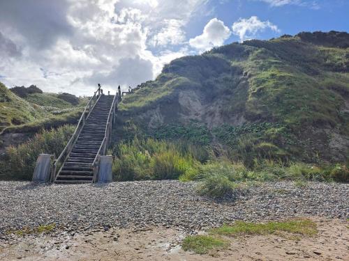 a group of people walking up a stairs on a hill at 6 person holiday home in Struer-By Traum in Struer