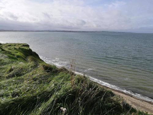 a view of a body of water with a beach at 6 person holiday home in Struer-By Traum in Struer