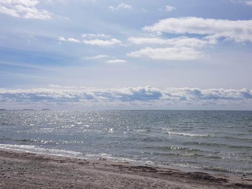 a view of the ocean from the beach at 6 person holiday home in Karrebæksminde-By Traum in Karrebæksminde