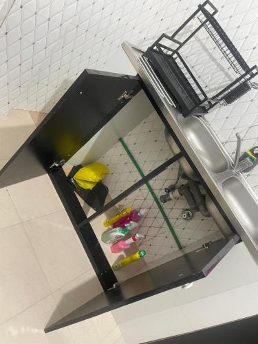 a room with a shelf with tools in it at Couzy entire home 20 min from international Airport in Luanda