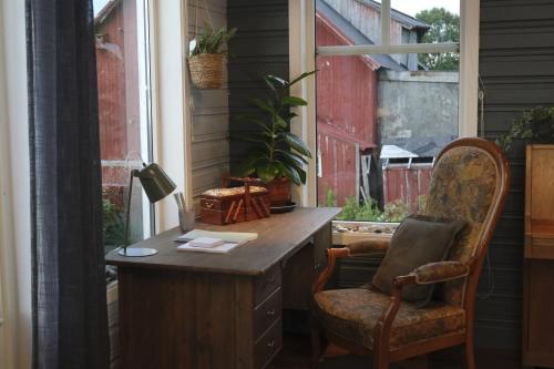 an office with a desk and a chair next to a window at 3ART recreation in Tromsø