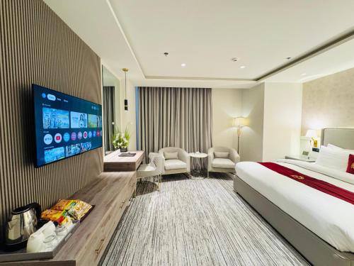 Ένα ή περισσότερα κρεβάτια σε δωμάτιο στο TAJ Executive Hotel With Premium Services