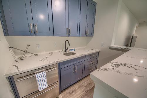 a kitchen with blue cabinets and a sink at CL 874 Million Dollar View in Canyon Lake