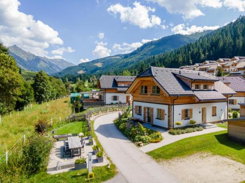 an aerial view of a house in a valley at Donnersbach Lodge in Donnersbachwald