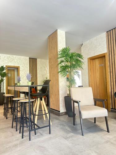 a dining room with a table and chairs at Prestige apartmani Zlatibor-Prestige Forest Resort in Zlatibor