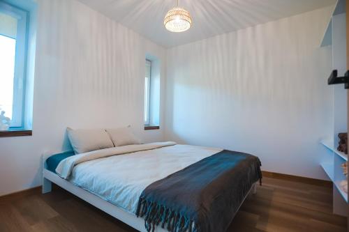 Ένα ή περισσότερα κρεβάτια σε δωμάτιο στο Home Stay Juniper-1