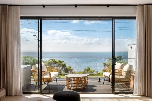 a view of the ocean from the balcony of a house at San Remo Luxe 2 in San Remo