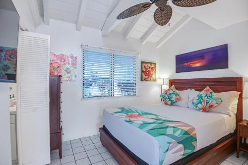 a bedroom with a bed and a ceiling fan at Big Island Retreat - No Resort Fees in Kailua-Kona