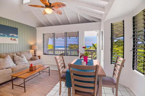 a living room with a table and a couch at Big Island Retreat - No Resort Fees in Kailua-Kona