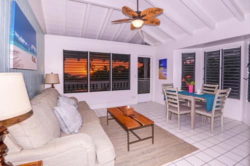 a living room with a couch and a table at Big Island Retreat - No Resort Fees in Kailua-Kona