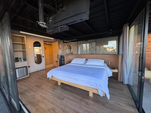 a large bedroom with a large bed in it at Hotel Casa Leon Rooftop in Rionegro