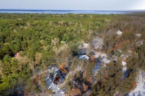 an aerial view of a forest with a house at Timber Haven Aframe Cabin - Brand New Hot Tub in Friendship