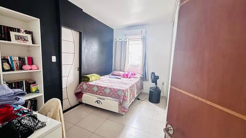 a small room with a small bed and a window at Casa para Cop 30 in Belém