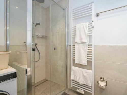 a bathroom with a shower with a glass door at One-bedroom apartment in Westerland (Sylt)