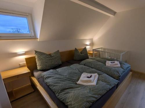 a bedroom with two beds with towels on them at Holiday home in Oelsnitz with swimming pool in Hohekreuz