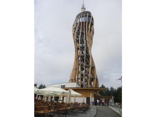 a building with a spiral tower with tables and chairs at Holiday home with 3 bedrooms in Twimberg
