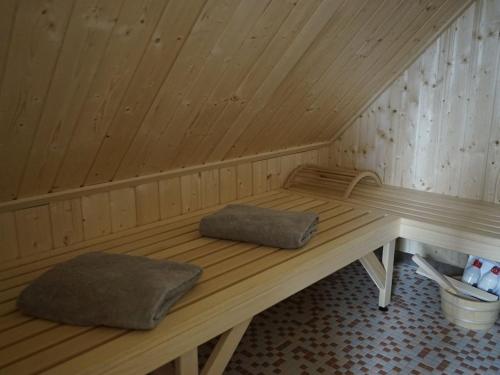 a wooden sauna with two pillows sitting in it at Holiday home in Vaschvitz with sauna in Vaschvitz