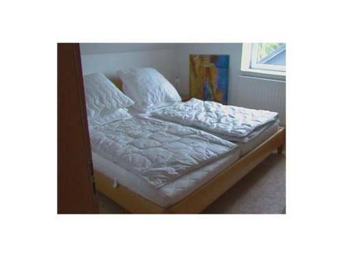 Katil atau katil-katil dalam bilik di Holiday home in Kudensee with swimming pool