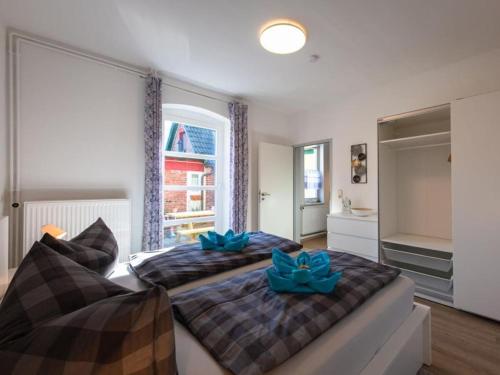 Katil atau katil-katil dalam bilik di Holiday apartment Ahrenshoop