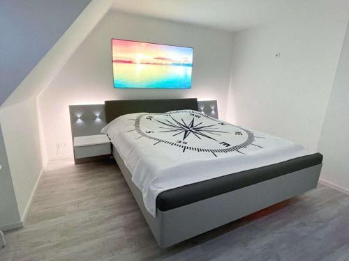 En eller flere senge i et værelse på Holiday home Bellaeins