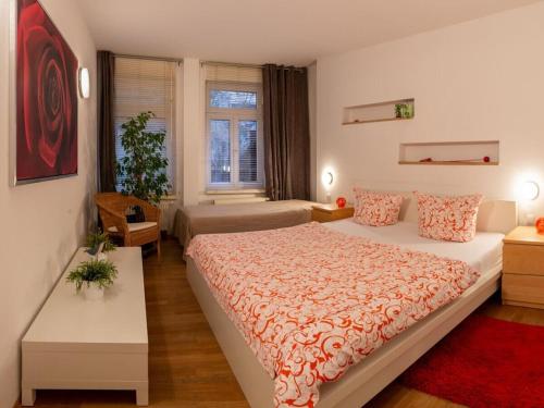 a bedroom with a large bed in a room at Family accommodation in Dresden