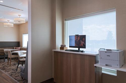 a office with a computer on a counter with a window at Residence Inn by Marriott Georgetown in Georgetown
