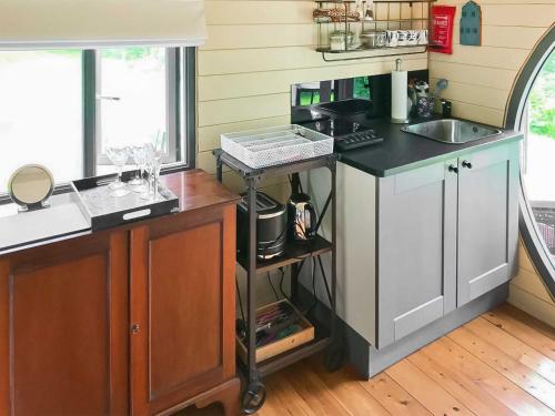 a kitchen with a counter and a sink and a counter top at Oak Retreat - Uk46650 in Crickhowell