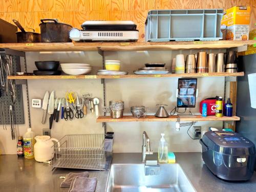 a kitchen counter with a sink and a microwave at SNUG CAMP HOUSE - Vacation STAY 98114v in Okubo