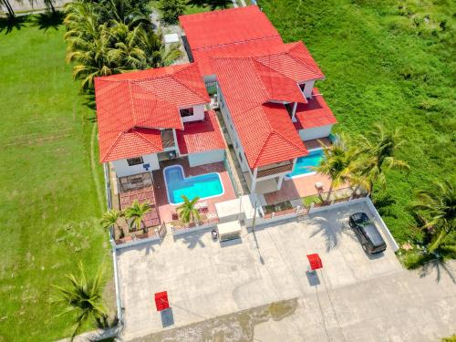 an aerial view of a house with red roof at Hotel Palmazul - Viña del Mar in Omoa