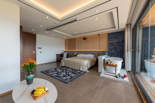 Postel nebo postele na pokoji v ubytování 铂诩海景客栈 BOXU Seaview Resort Villa
