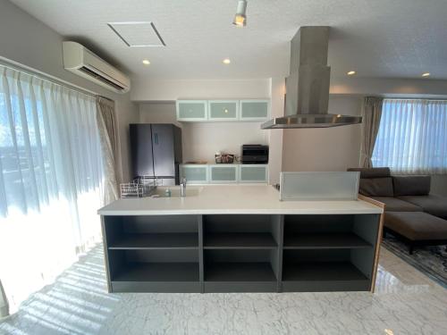 a kitchen with a large island in the middle at Empire Skyridge Hotel - Vacation STAY 17783 in Chikugo