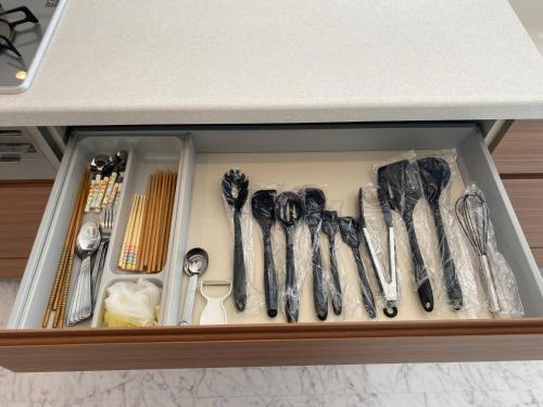 a drawer filled with utensils in a kitchen at Empire Skyridge Hotel - Vacation STAY 17783 in Chikugo