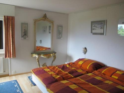Ένα ή περισσότερα κρεβάτια σε δωμάτιο στο Blonay Holiday Apartments