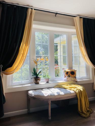 a window with a bench in a room with windows at Private Estate, walk to Princeton downtown, 3 Bedrooms, 2 Bath, with Free Parking in Princeton