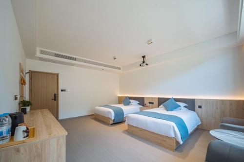 Huazhu Songshiju Homestayにあるベッド