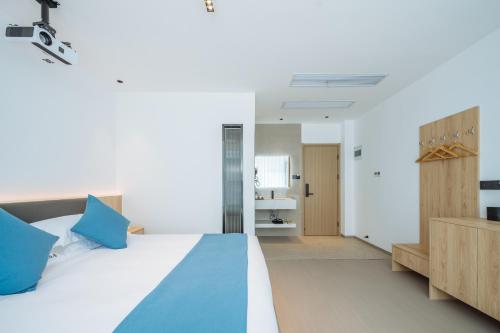 Huazhu Songshiju Homestayにあるベッド