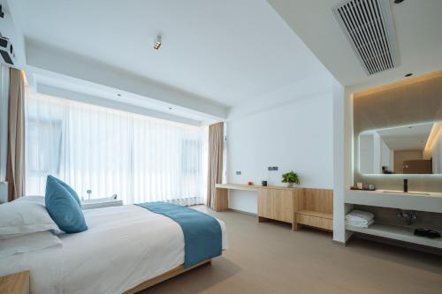 Huazhu Songshiju Homestayにあるベッド