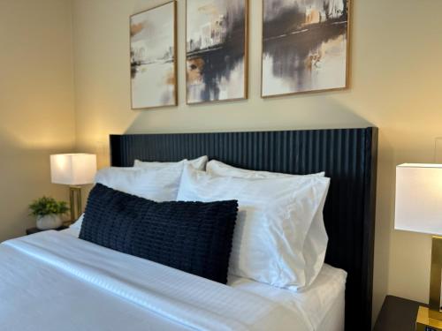 a bedroom with a bed with white sheets and pillows at Mainstay Inn in Phoenixville