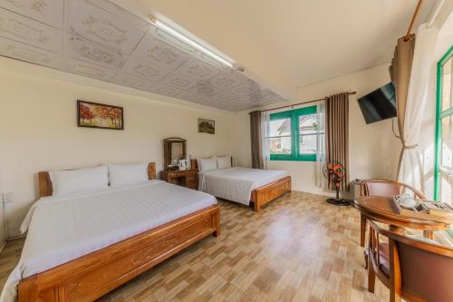 Katil atau katil-katil dalam bilik di Mộc Yên Home Dalat