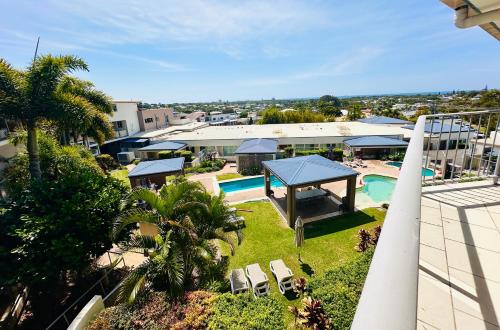 an aerial view of a resort with a swimming pool at Caloundra Central Apartment Hotel Official in Caloundra