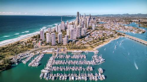 an aerial view of a city with a marina at Oscar On Main Beach Resort in Gold Coast