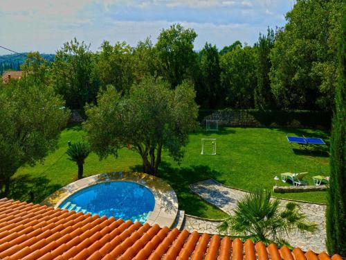 a view of a yard with a swimming pool at Villa in Čilipi near Dubrovnik with Pool in Čilipi