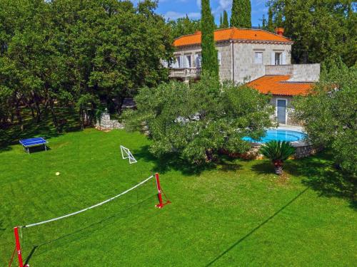 an aerial view of a yard with a pool and a house at Villa in Čilipi near Dubrovnik with Pool in Čilipi