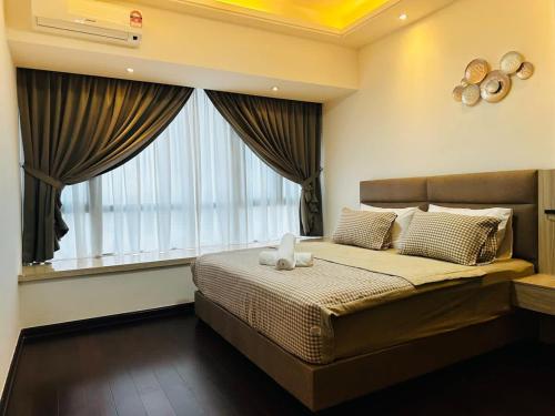 Ένα ή περισσότερα κρεβάτια σε δωμάτιο στο Ivory Homes at R&F - free WiFi and 1 Car Park