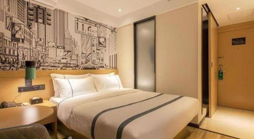 a hotel room with a large bed and a desk at City Comfort Inn Wuhan International Expo Center Yongwang in Wuhan