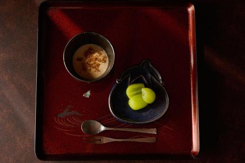 a tray with a bowl of food and a cup of coffee at Ochiairo in Izu