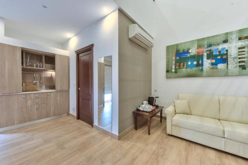 a living room with a couch and a table at Palazzo Violetta in Sliema