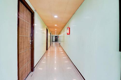 an empty corridor in a building with a hallway at Super Collection O Rama Lakshmana Junction Srikakulam in Srīkākulam
